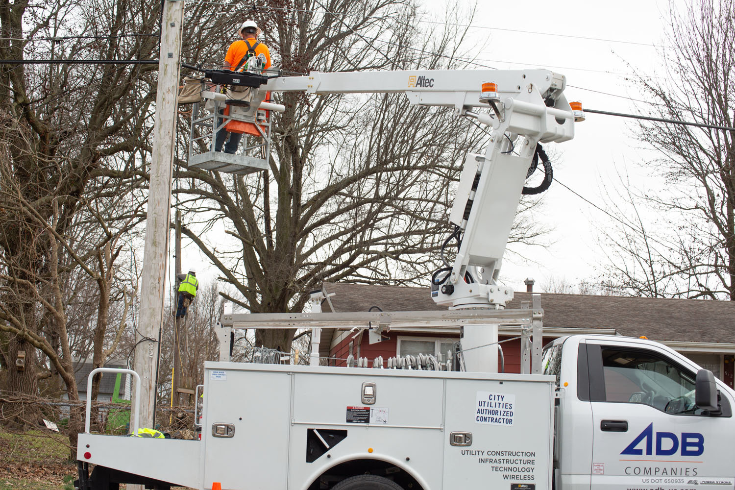 City Utilities' crews install fiber-optic lines near West Norton Road as part of a $120 million fiber network expansion.